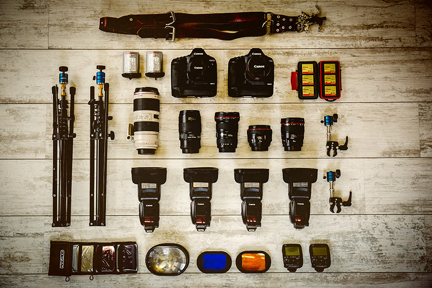 a number of different types of cameras on a table.
