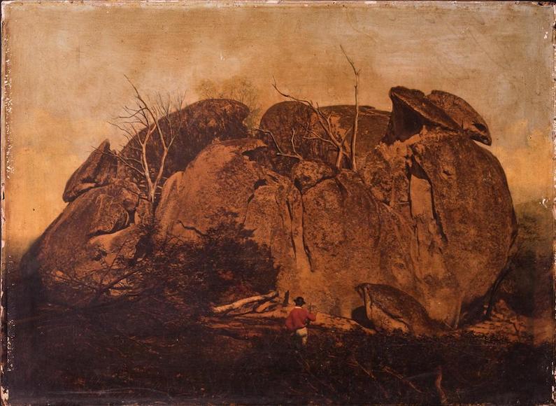 a painting of a man standing in front of a large rock taken by Richard Daintree.