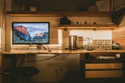 computer backing up photos to hard drives on a desk