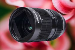 A lens with a flower in the background.