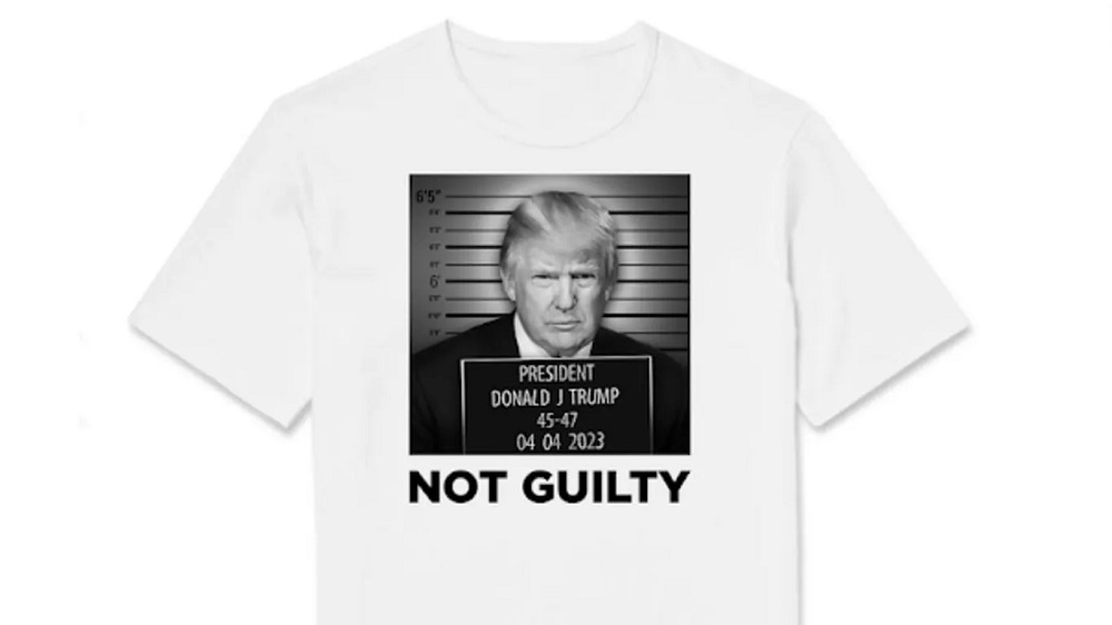 A white t - shirt with a photo of donald trump and the words not guilty.