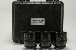 A set of three lenses in a black case.