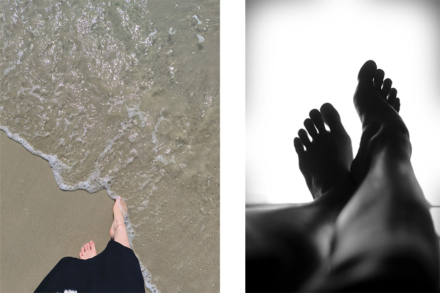 A black and white photo of a person's feet on the beach.