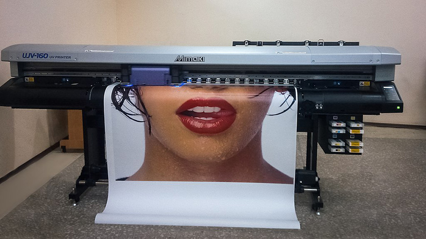A printer with a woman's face on it.