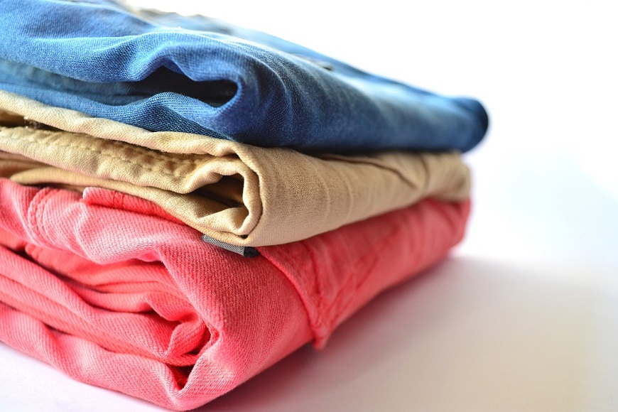 A stack of clothes on a white background.