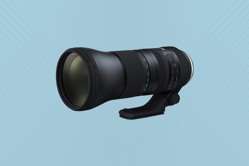 A Tamron 150-600mm f/5.6-6.3 lens on a blue background.