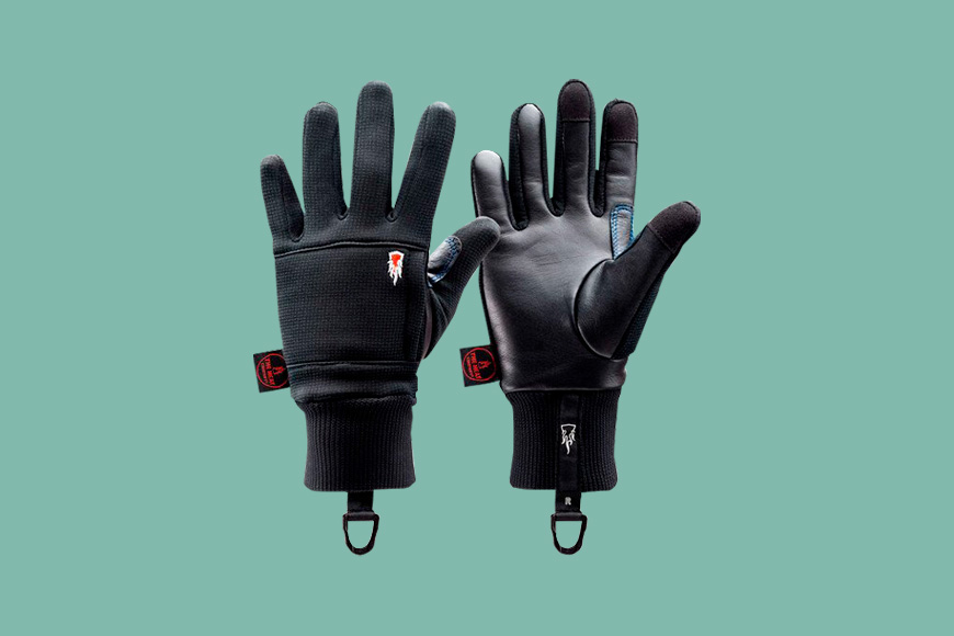 The Heat Company Polartec Wind Pro Liner gloves on a green back ground.