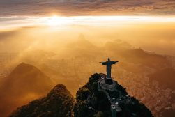 Christ the redeemer statue on top of a mountain in rio de janeiro, brazil.