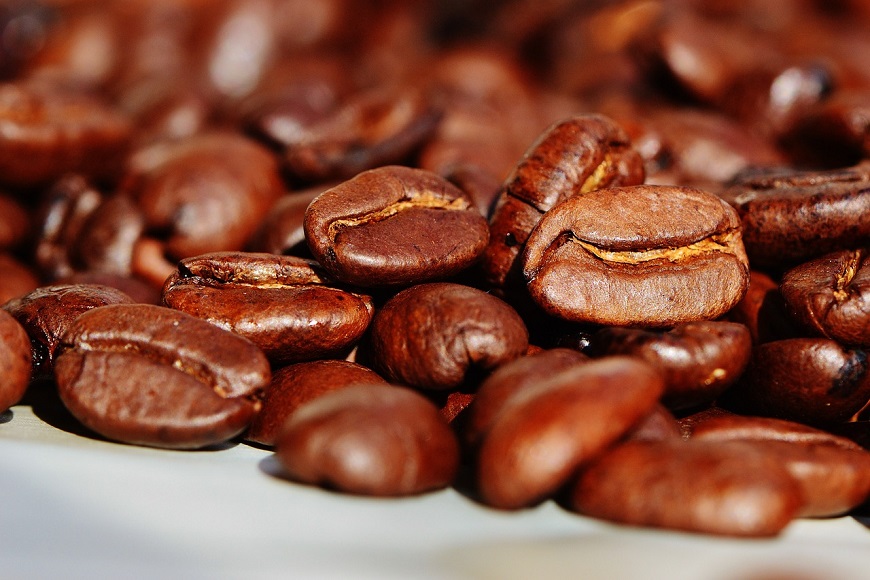 A pile of coffee beans on a table.