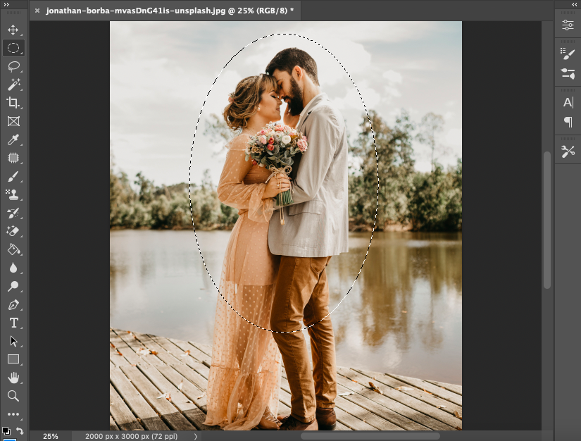 A couple kissing on a dock in adobe photoshop.