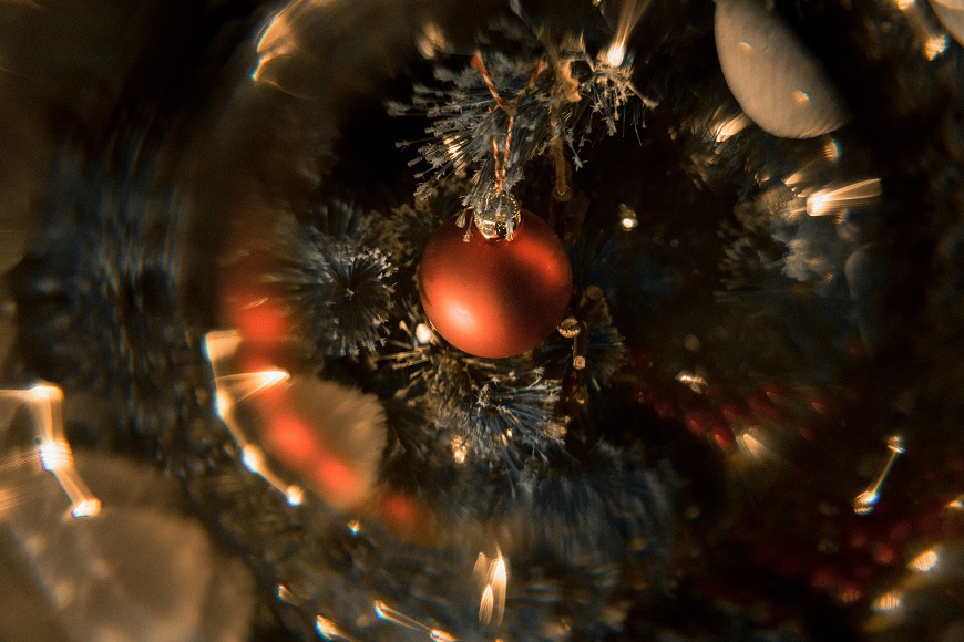 A christmas ball in a christmas tree.