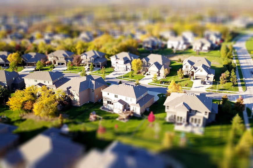 An aerial view of houses in a suburban neighborhood.