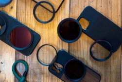 A group of phone cases with different lenses on them.