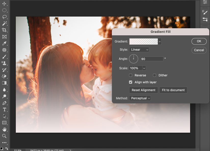 A photo of a woman kissing her baby in adobe photoshop.