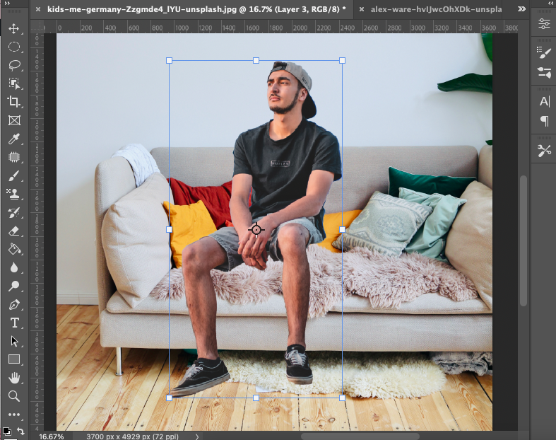 A man sitting on a couch in adobe photoshop.