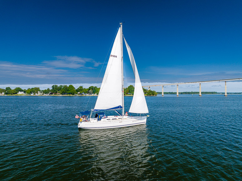 A sailboat on a body of water.