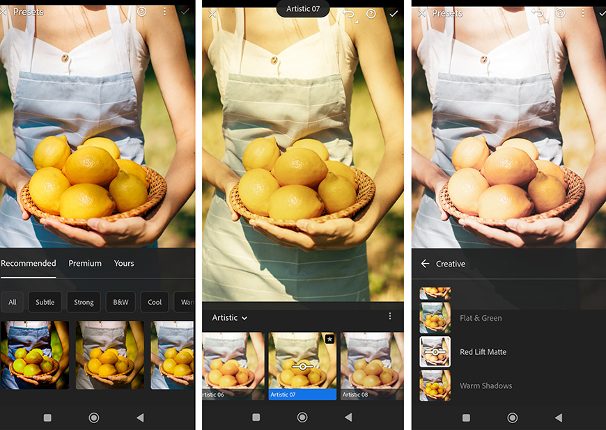 A woman is holding a bunch of oranges in front of a camera.