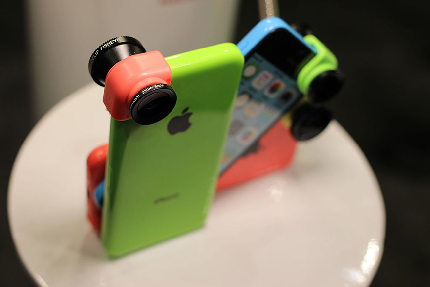 A colorful iphone with a camera attached to it.