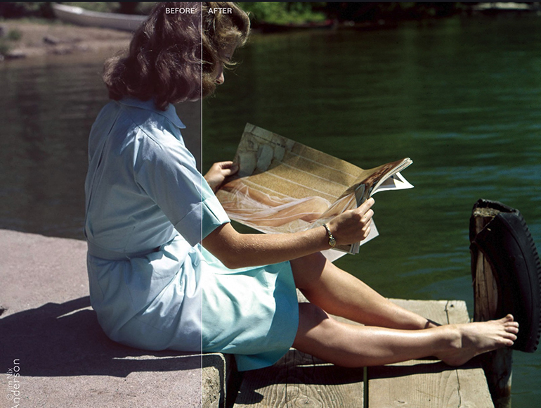 A woman sitting on a dock reading a newspaper.