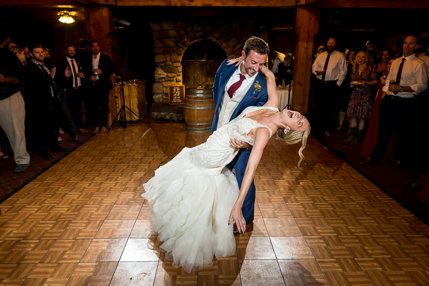 A bride and groom dancing on the dance floor at their wedding reception.