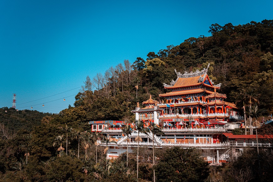 A chinese temple on top of a hill.