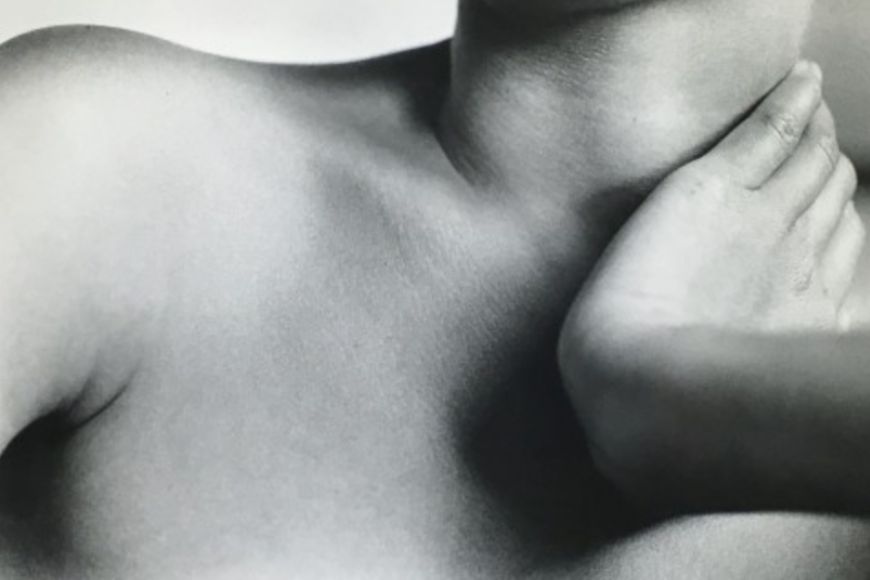 A black and white photo of a woman's neck.