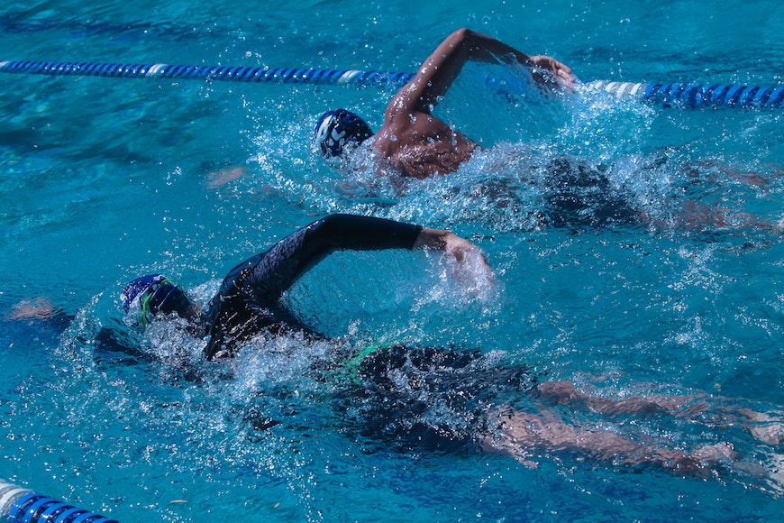 Two swimmers in a swimming pool.