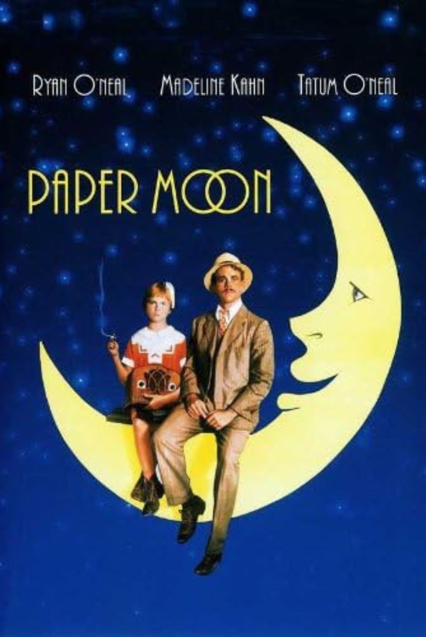 A movie poster for paper moon with two people sitting on the moon.