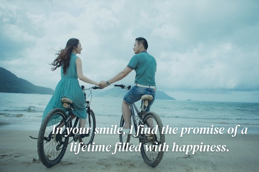 A man and woman on a bicycle holding hands with the words find the promise of a lifetime filled with happiness.