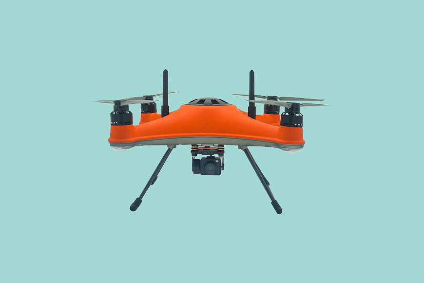 A small orange drone on a blue background.