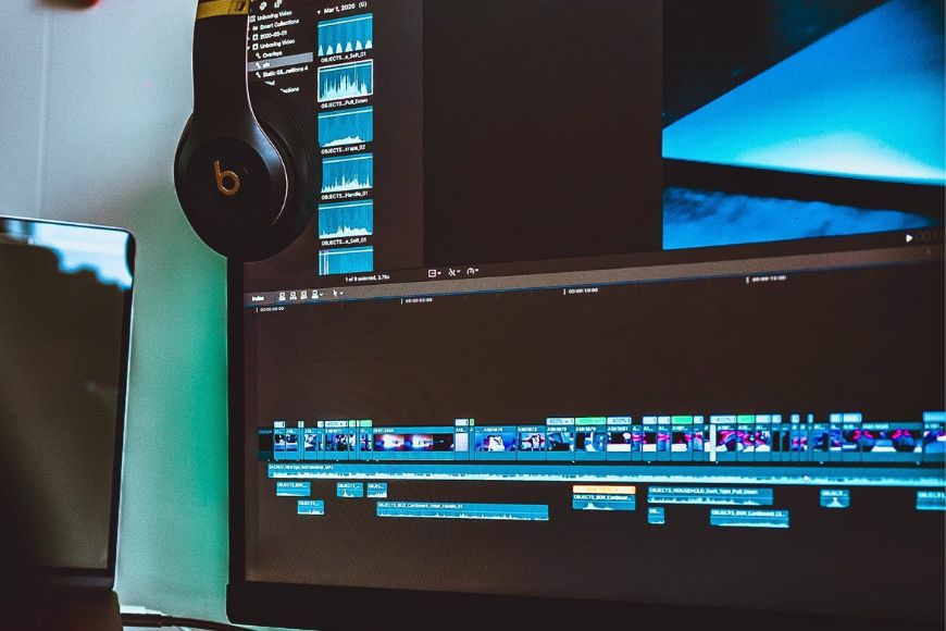 A monitor with a video editing program Final Cut Pro on it.