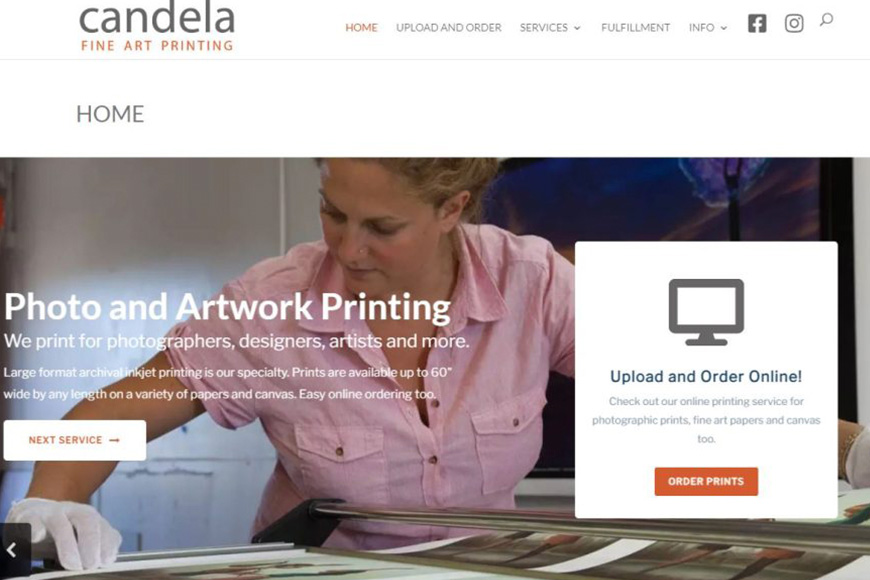 A woman is working on a photo and art printing website.