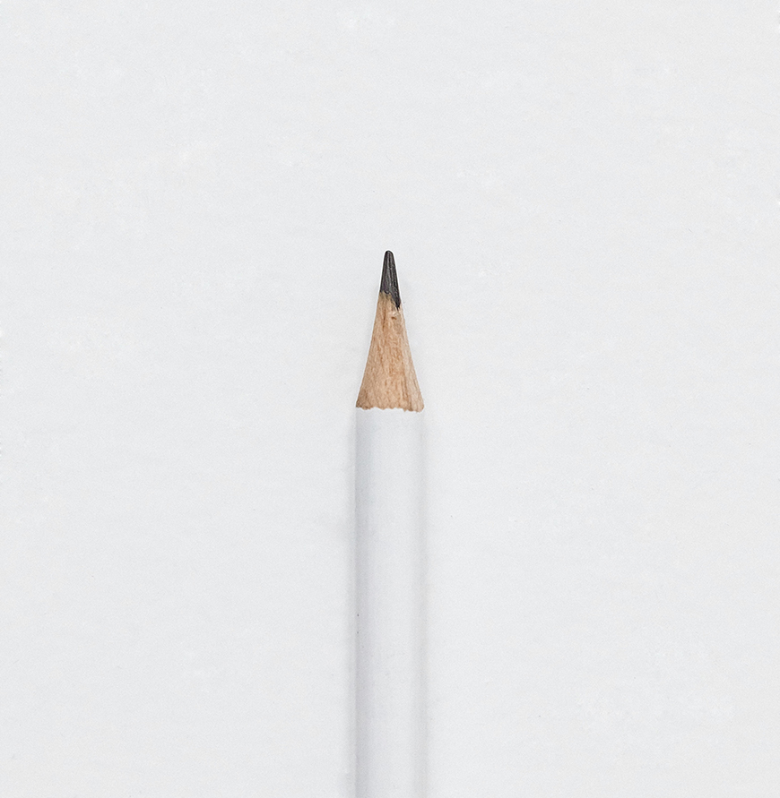 A pencil on a white surface.