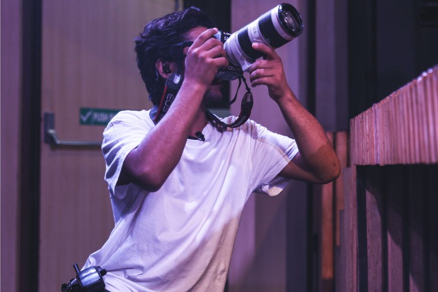 A man taking a picture with a camera.