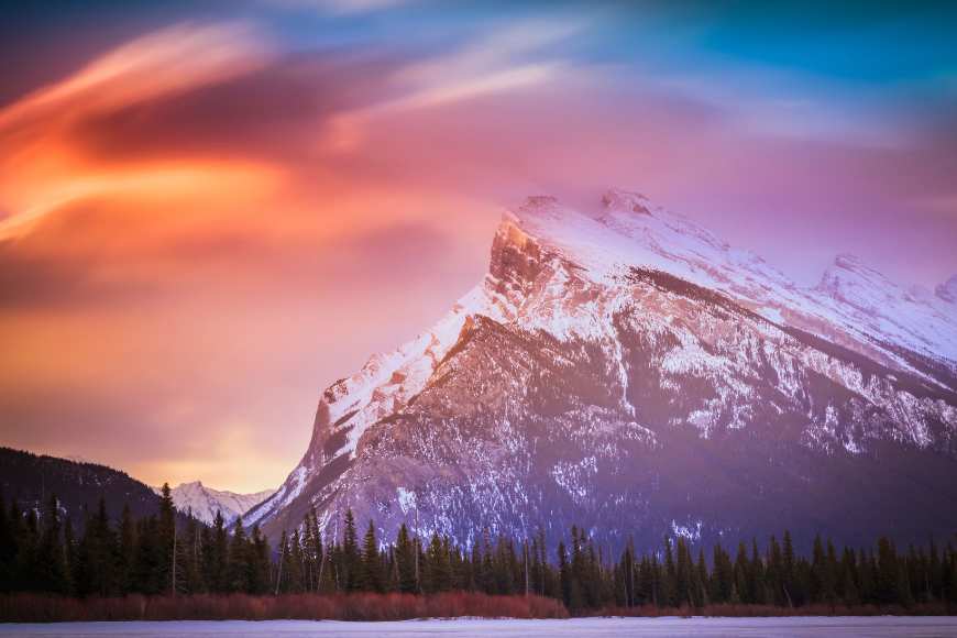 Image of a mountain with a colorful sunset over a lake, captured using an FDL filter