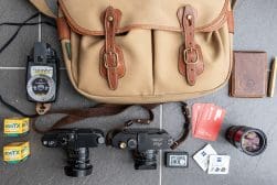 A bag with a camera and other items on it.