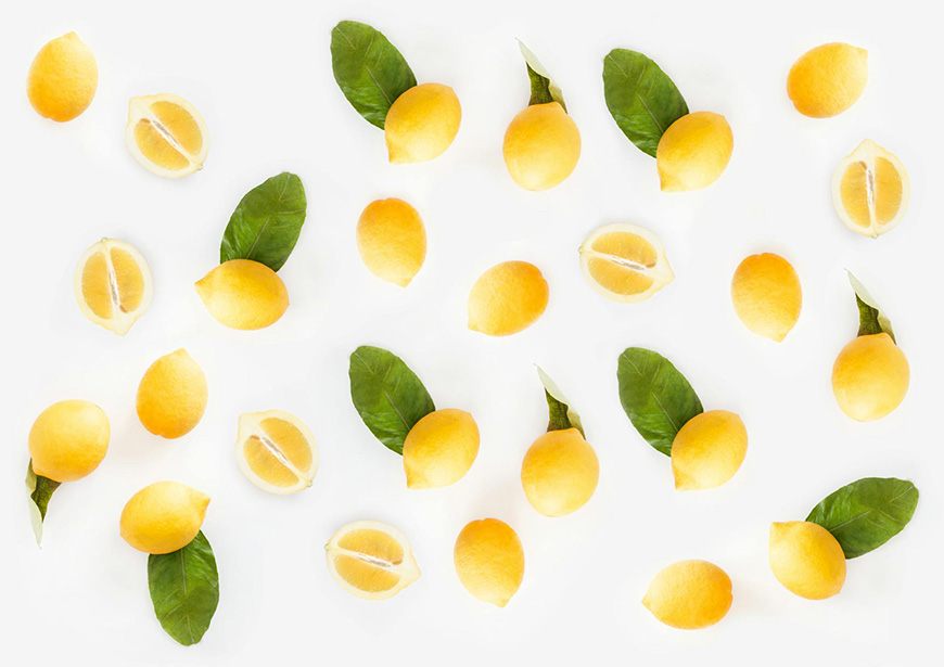 Lemons and leaves on a white background.