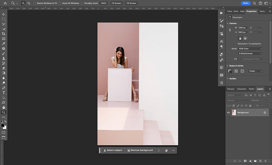 A photo of a woman standing on a staircase in adobe photoshop.