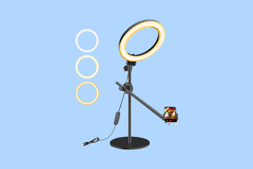 A ring light with a cell phone on it.