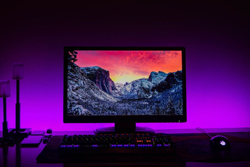 A computer monitor with a purple light on it.