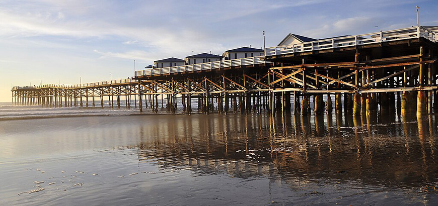 A wooden pier on the beach.