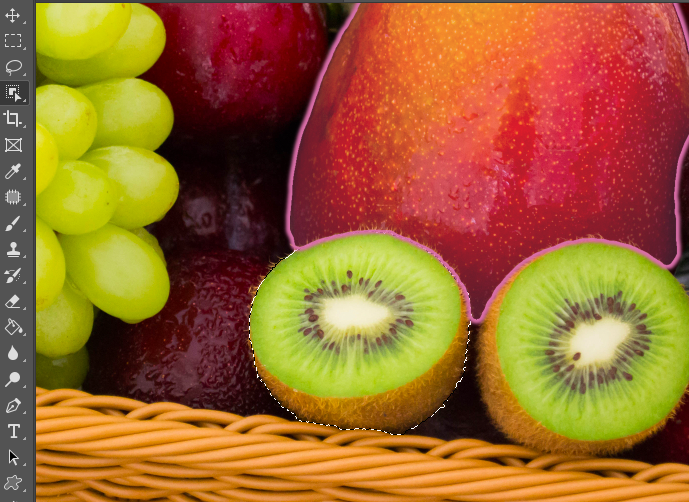 A photo of fruits in a basket in adobe.