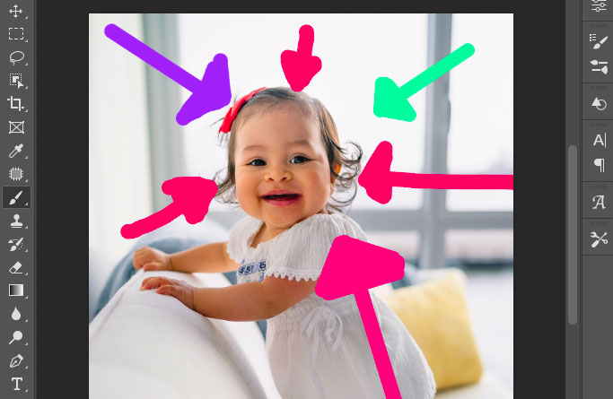 A photo of a baby with arrows in the background.