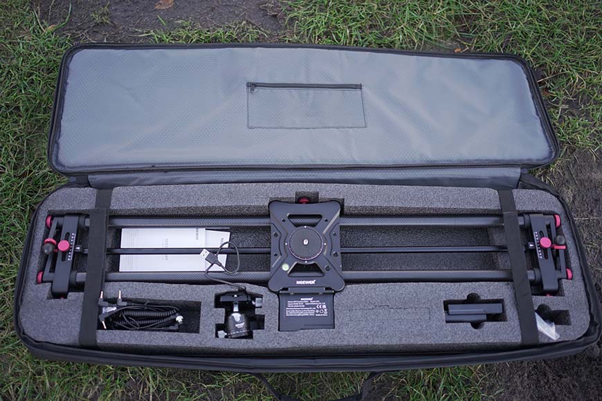 A black case with a camera and other equipment inside.