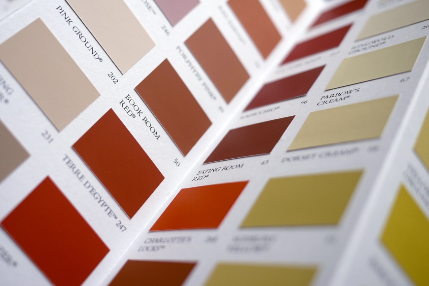 A close up of a book of paint colors.