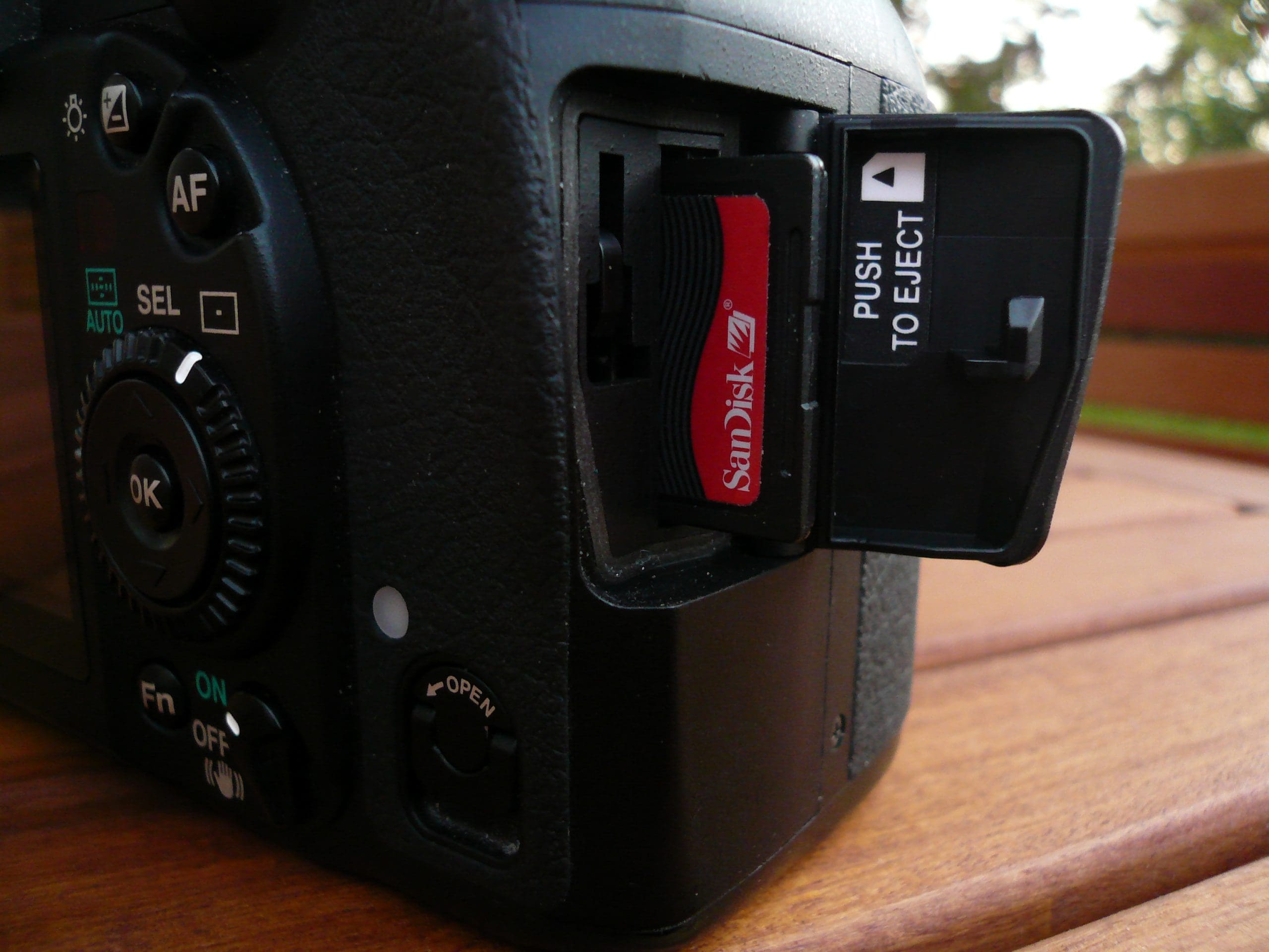 A camera with a memory card attached to it.