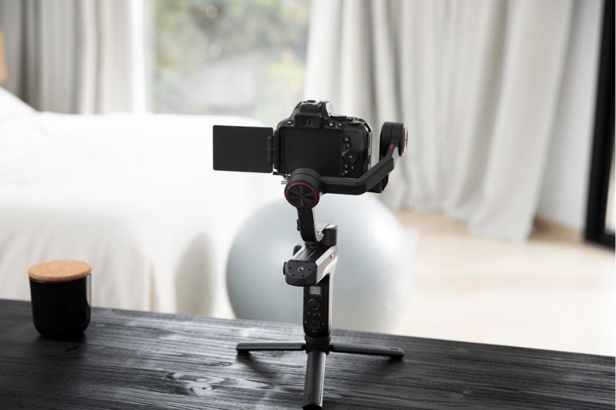 A tripod with a camera on top of it.
