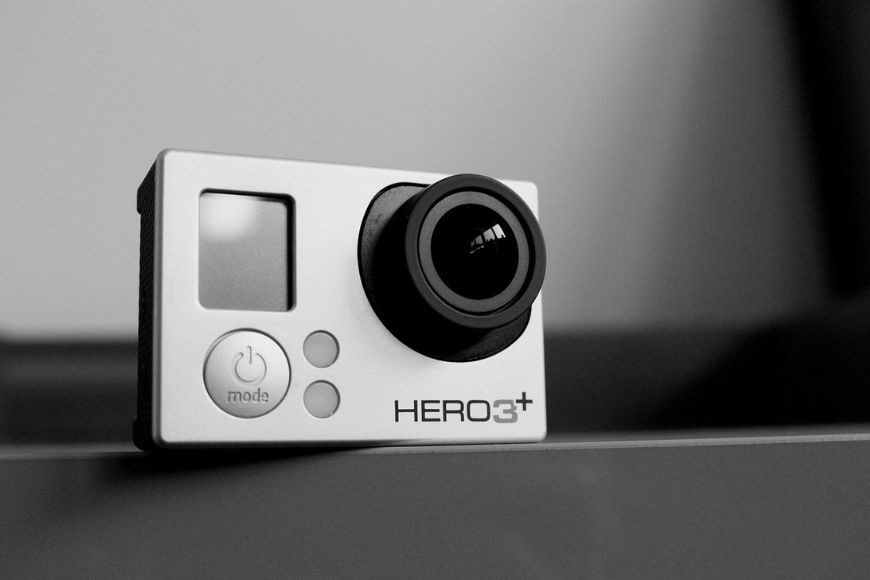 A black and white image of a gopro camera.
