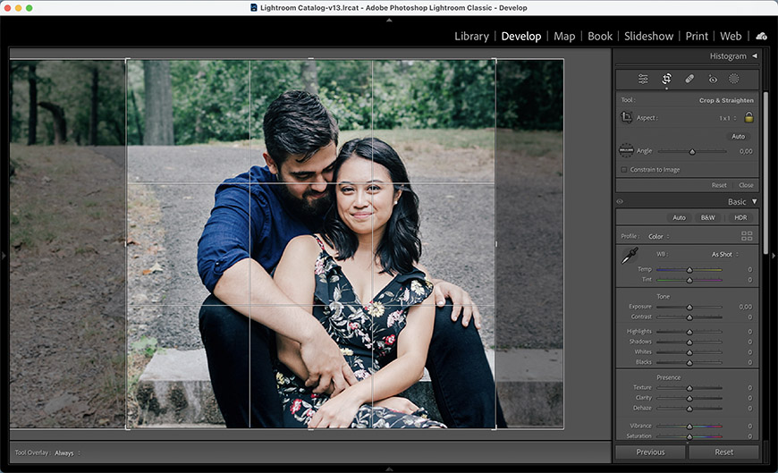 A couple posing for a photo in lightroom.