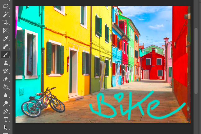 A photo of a colorful street with a bicycle in the background.